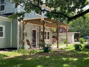 Wooden pergola outside house