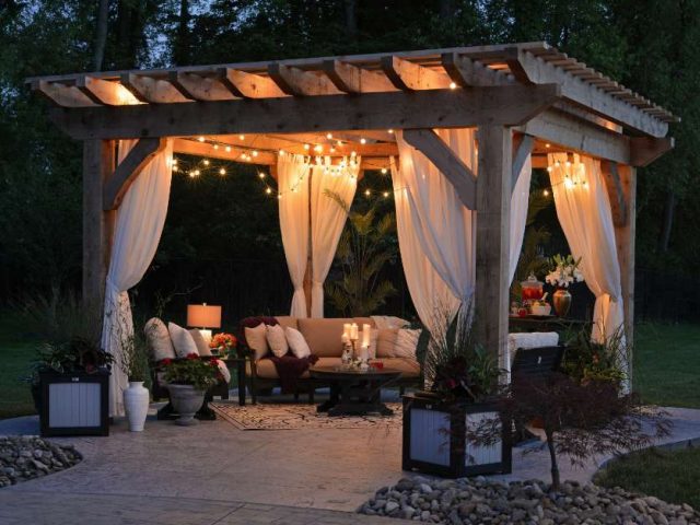 A pergola lit up at night