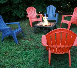 A fire pit surrounded by chairs